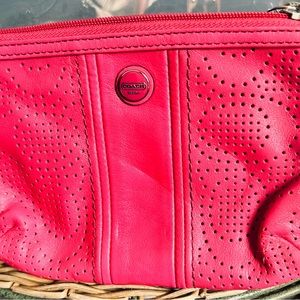 Coach medium sized wristlet with strap.